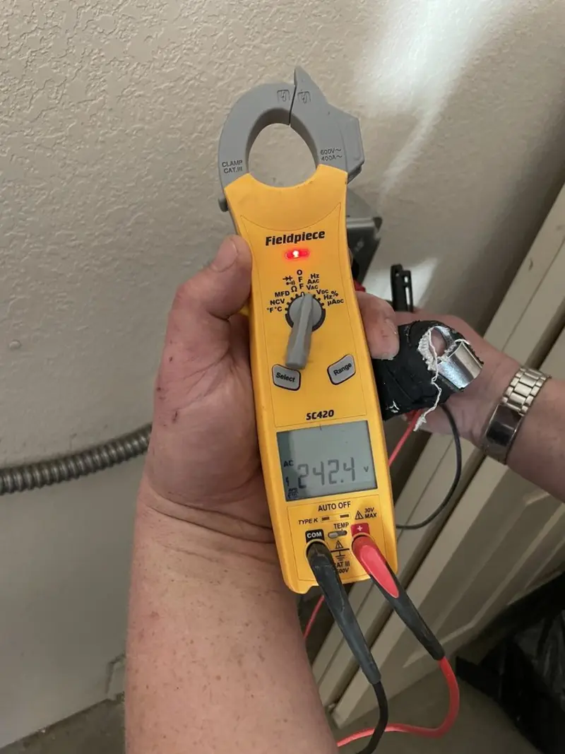 Voltage testing with clamp meter during Whole House Surge Protector in Abilene